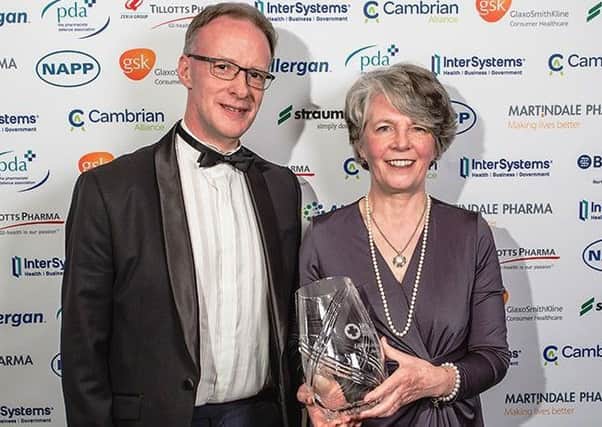 Dr Rosemary Black, receiving her Life Time Achievement at the Northern Ireland Healthcare Awards from Southern Trust Medical Director, Dr Richard Wright.