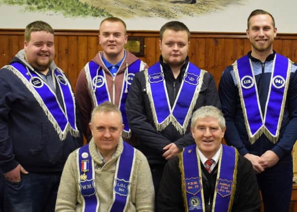 Four new members have been initiated into the Purple Start Orange Lodge in Randalstown.