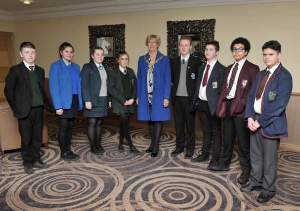 The Mayor Alderman Hilary McClintock pictured with student representatives from some of the schools that attended the Prejudice Face On event held recently in the White Horse Hotel. DER0917GS010