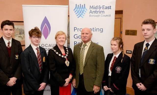 The Mayor of Mid and East Antrim Cllr Audrey Wales MBE, Guest Speaker Billy Kohner MBE, and pupils from local post primary schools who participated in Councils recent Holocaust Memorial Day events at Carrickfergus Town Hall.