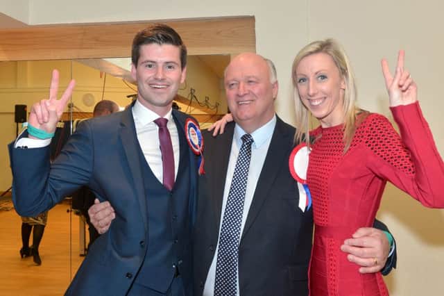 The DUP's Jonathan Buckley, left, celebrates being elected with fellow MLA, Carla Lockhart and Upper Bann MP, David Simpson.
Photo by Tony Hendron / Press Eye.