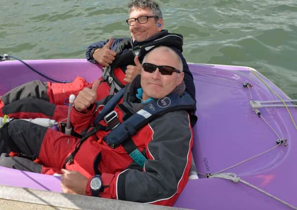 Thumbs up from skipper, Stephen Molloy and crew member, Paul Green at the HANSA 303 Irish Championship event hosted by Belfast Lough Sailability. INCT 31-015-PSB