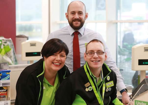 Asda Larne General Store Manager, Niall Keyes, Asda Larne Community Champion, Catherine McCallion with Stephen.