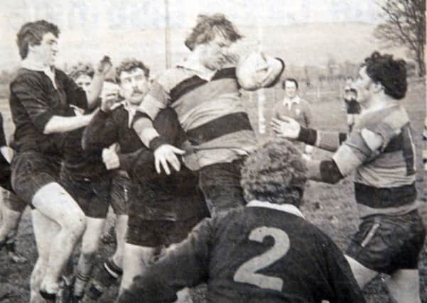 Lurgan Rugby Club's Pete Drennan wins the line out ball in a match aginst Limavady. The game was played in March 1981.