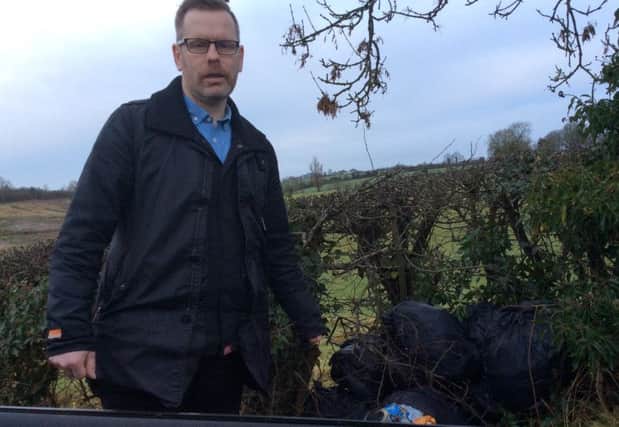 Councillor Kevin Savage highlights fly-tippinf on the Lowtown Road near Laurencetown. INBL fly-tipping