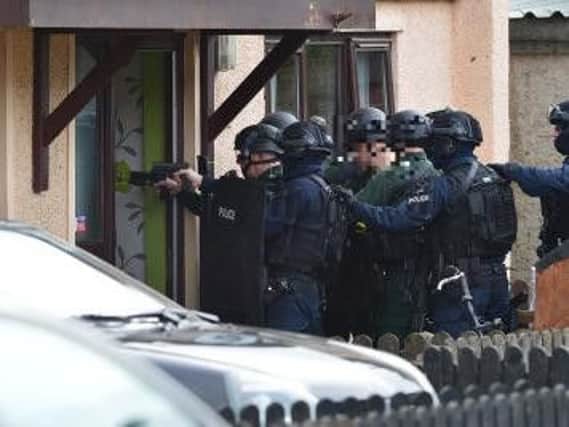 Armed police carried out raids following the shooting