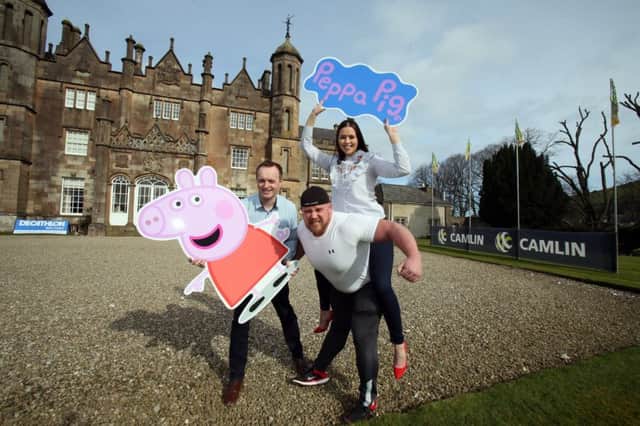 Cool FM's Rebecca McKinney and Downtown Radio's Gary Myles launch the seventh annual Dalriada Festival, powered by Camlin, with Strongman Chris McNaughton, to take place at Glenarm Castle from 14th - 16 July.   Picture Paul Faith