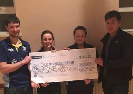 Glarryford YFC members present Â£1574 from their Big Breakfast and car wash morning for David McCleans Cancer Treatment fund.