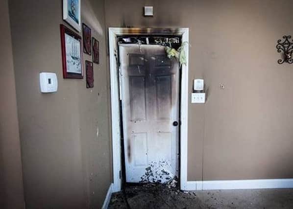 Door damage from fire, it held back