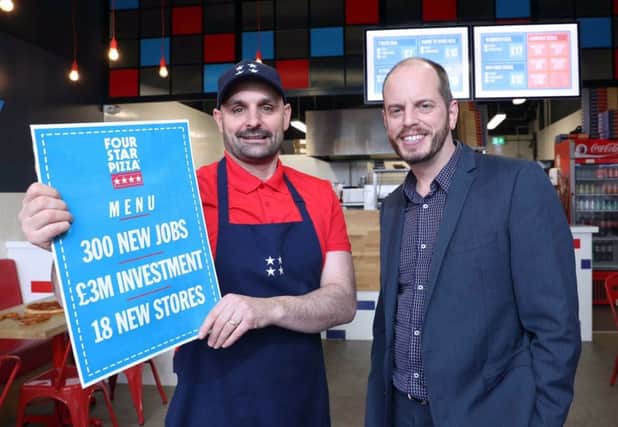 Brian Clarke, Director, Four Star Pizza (right) and store owner, Scott Higginson, celebrate the announcement that Four Star Pizza is to create 300 jobs, invest Â£3m and increase its number of stores to 30 in Northern Ireland over the next three years.
