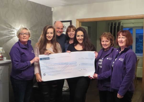 Gary McKinstry, along with his wife Amanda and daughters, Cara and Jodie, presenting a cheque for Â£1500 for N.I. Childrens Hospice to Roma Brown, Jennifer Beattie and Davina Adair of the Larne Support Group for N.I. Hospice.  
Gary celebrated his 50th birthday with a party night and a Golf Competition in Cairndhu Golf Club and requested donations to be made to the Childrens Hospice in lieu of gifts. Special thanks are extended to P & O Ferries, Colin Farr (Whitehead Golf professional); Matthew Stewart (Director of Golf at Cairndhu Golf Club) for donating Golf Day prizes; to everyone who played in the two day event; and, all Garys family and friends who very generously donated money in lieu of birthday presents.
(Picture kindly submitted).
