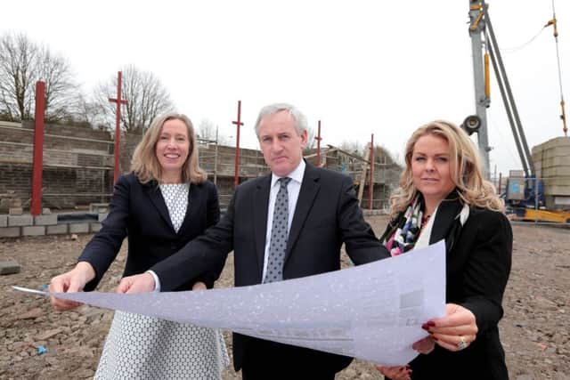 Aisling Owens (left), chief executive of Lisburn Enterprise Organisation examining plans for the new office accommodation with Andrew Robinson, chairman, and Colleen McAreavey, senior business advisor.