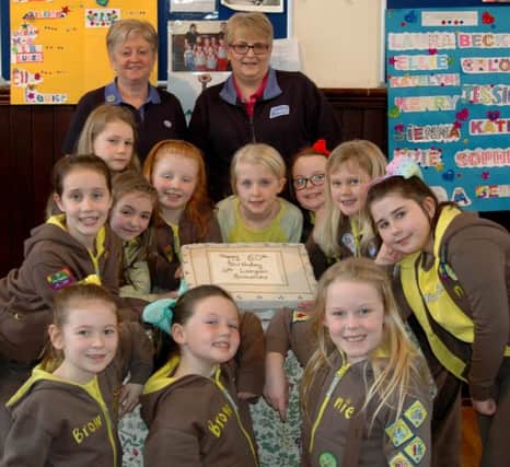 Brownie leaders Helen Stevenson (back left) and Dianne Lauder with members of 4th Lurgan Brownies (Queen Street Methodist) who are celebrating their 50th anniversary. Following the Girl Guide Thinking Day service, parents were invited to tea and cake, where a collection of Â£360 was raised for the Royal Belfast Hospital for Sick Children. Brownies included in the picure are Katie Gribben, Ella Louise Strain, Megan Stewart, Kacie Gilkinson, Lucee Brown,Brooke Armstrong, Mia-Lillie Jardine, Grace Mackay,Victoria Lockhart, Kelsie Williamson.  Picture by Charles Cockcroft.