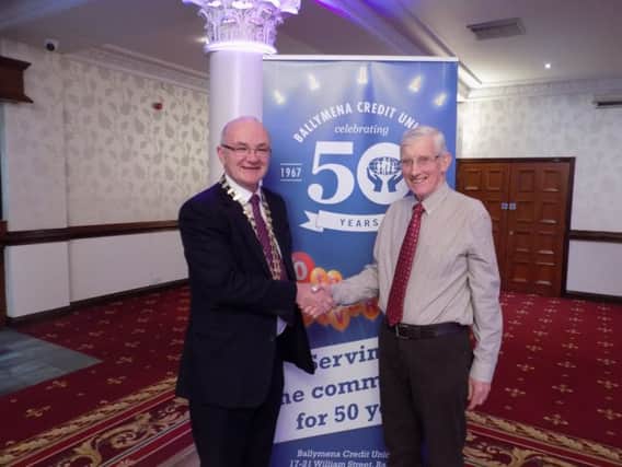 The 50th anniversary presentation to Francis Scullion, (right) to mark him being the last surviving member of the original Board of Directors of Ballymena Credit Union.