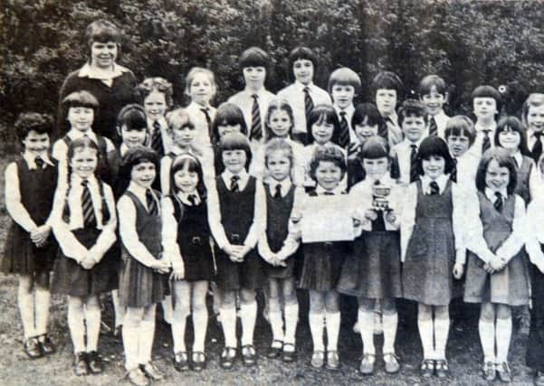 The Tullygally primary School infant choir who in 1981 won the Ferguson Cup at the Portadown Music Festival. Mrs Barbara Holden and Mrs Joan Mitchell were in charge.