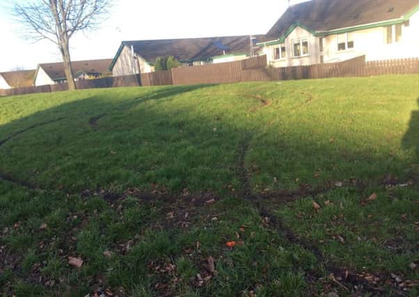 Tyre marks on the green near Ballyoran Park.