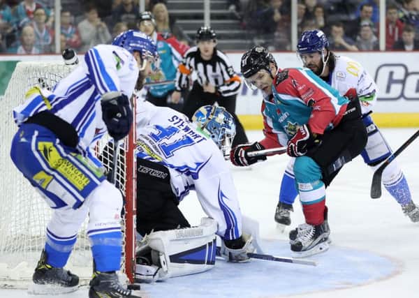 Belfast Giants' David Rutherford with Coventry Blaze's Brian Stewart during Saturday nights Elite Ice Hockey League game at the SSE Arena Belfast.