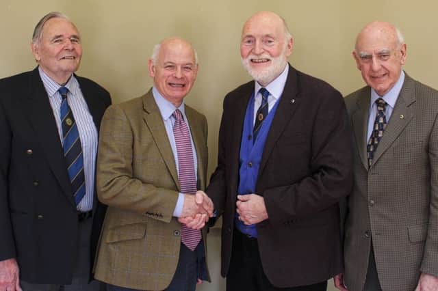 Coleraine Probus President Mike Turner greets Stephen Connolly with club members Bob McIvor (L) and Jim Hillis (R).
