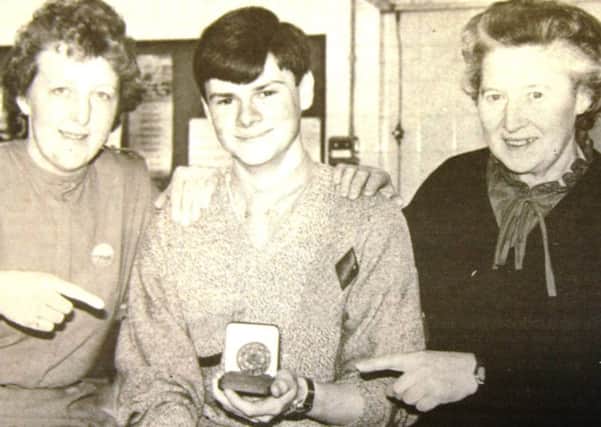 Medal-winning catering student Garfield Anderson in 1985 with course tutor Elizabeth McNeill and Doreen Pillow, head of economics and catering.