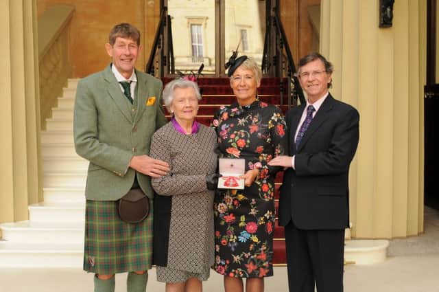 Portrush GP Dr Pamela Logue was presented with the MBE in February. She was accompanied by her brothers Prof David Logue, Mr Alan Logue and her aunt Mrs Polly Logue.