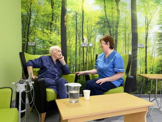 Patient Terence Lawless before he was discharged from Craigavon Area Hospitals new discharge lounge with staff nurse, Maureen Brown