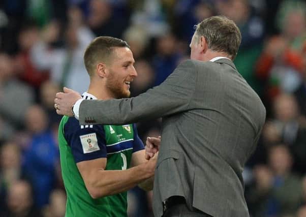 Northern Ireland goal scorer Conor Washington receives his plaudits from manager Michael O'Neill.
Photo Colm Lenaghan/Pacemaker Press