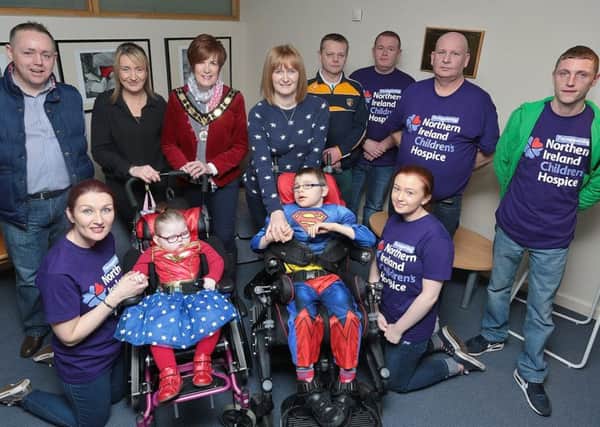 Cllr Noreen McClelland with club members, business representatives and families at the charity launch event.