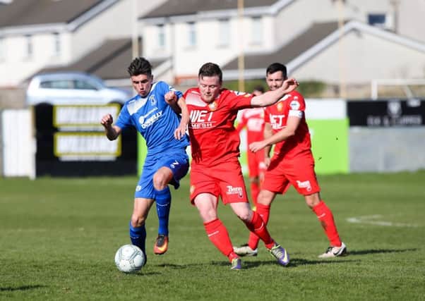 Jamie Glackin (left) battling for the ball under pressure from Portadown's Brendan Shannon during Dungannon Swifts' visit to Shamrock Park. Pic by PressEye Ltd.