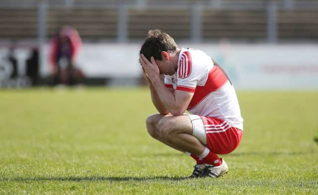A frustrated Benny Herron holds his head in his hands at the final whistle.
 (Photo Lorcan Doherty / Presseye.com)