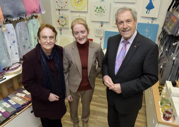 Councillor Uel Mackin (right), Chairman of the council's Development Committee, called in to Rosie's Emporium to wish owner Rosaleen Stewart (centre) all the best for her new venture. Also pictured is Marian Gordon.