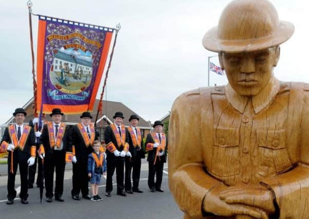 Members of LOL62 at the unveiling of a wooden soldier commemorating the Battle of the Somme.