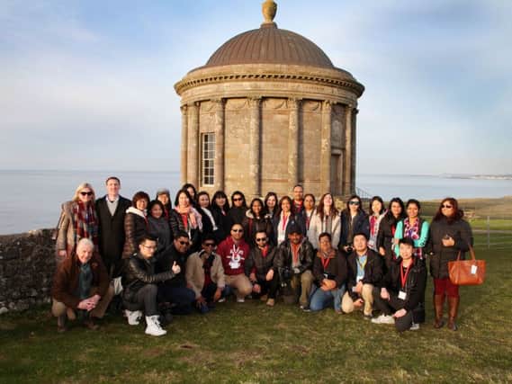 Siobhan Naughton and James Kenny, Tourism Ireland ( back row, left)  with the international tour operators at Mussenden Temple, Castlerock.