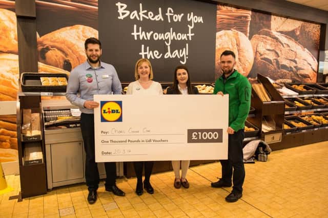 Lidl presents Â£1000 to CHARIS Integrated Cancer Care.