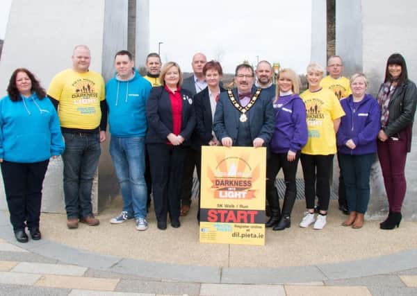 The Mayor of Antrim and Newtownabbey, Cllr John Scott , pictured with representatives from Turning Point, Focus, Tesco, PSNI Newtownabbey and Antrim and Newtownabbey Borough Council staff members.