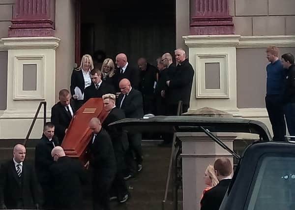 Jack Glenn's heartbroken mother, father and other relatives emerge behind his coffin following his funeral service.