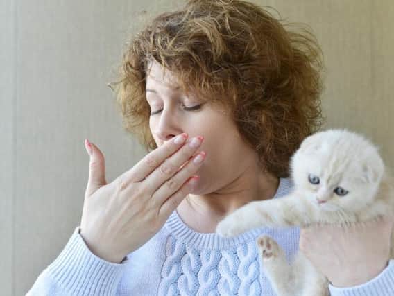 A woman with a cat allergy