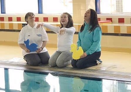 (From left) Grainne Close of Autism Initiatives NI, fundraiser Charlotte Smith and Sarah Jane Woods, owner of Swimming Buddies.