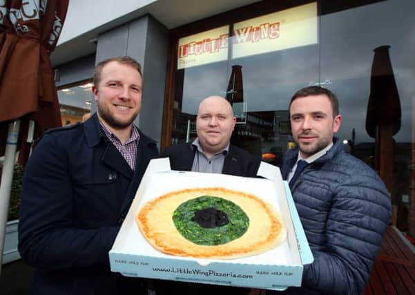 EYE ON PIZZA: Liam Cullen of Mercury Security Management (centre) is joined by Jamie Mendez of Little Wing (left) and Kevin Reilly of Beannchor (right) to announce the news that Mercury has been awarded the contract to provide a comprehensive security solution for one of the countrys biggest hospitality groups. The Beannchor security contract will see Mercury responsible for the maintenance and monitoring of fire alarms, intruder alarms and CCTV systems across 10 Beannchor sites including the Little Wing Pizzeria chain, The National Grande CafÃ© & Sixty6 Nightclub, The Hillside Bar and The Dirty Onion.