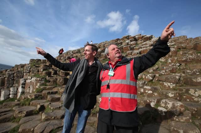 RTE's Ryan Tubridy gets a guided tour from Keith Acheson at the Giants Causeway as he experiences a Giant Mini Trip first hand as part of recording for the Ryan Tubridy Show Ryan and his team spent Sunday at the world famous Giants Causeway before taking a boat trip to look at the Giants Causeway from the sea and then on to the Carrickarede rope bridge. Picture Steven McAuley/ McAuley Multimedia