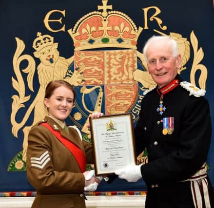Coleraine teenager, Hollie McCartney, has been honoured at a formal ceremony at Hillsborough Castle, appointed to the role of Her Majestys Lord Lieutenants Cadet for the County of Londonderry. She is pictured with the Lord Lieutenant MR Denis Desmond OBE.