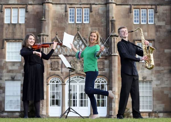 Claire hits a high note with the EA Youth Orchestra at Glenarm Castle ahead of their Hits from the Musicals concert in May,