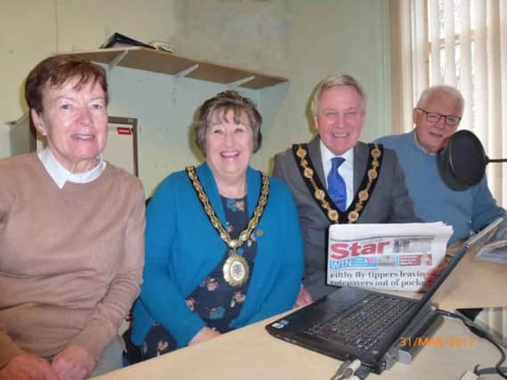Pauline McShane, Mrs Rosalind Bloomfield, Councillor Brian Bloomfield MBE and Derek Shuter preparing to record The Ulster Star for the Lisburn Leo listeners.
