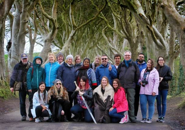 Overseas media took part In a Game of Thrones tour of Northern Ireland, included with them at the Dark Hedges, Ballymoney, are Colette Kelly, Tourism Ireland ( front right) and Aileen O'Neill, Tourism NI (front left). Pic by Paul Nash.  INBM 16-702-CON