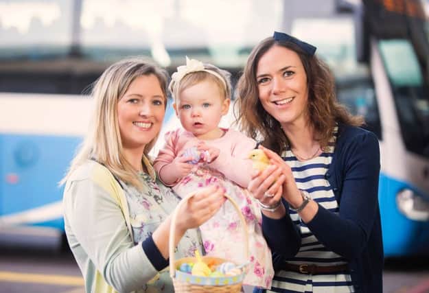 Pictured with Translink's Gemma Thompson is passenger Maura Sloan and her daughter, Tierna (age 1).