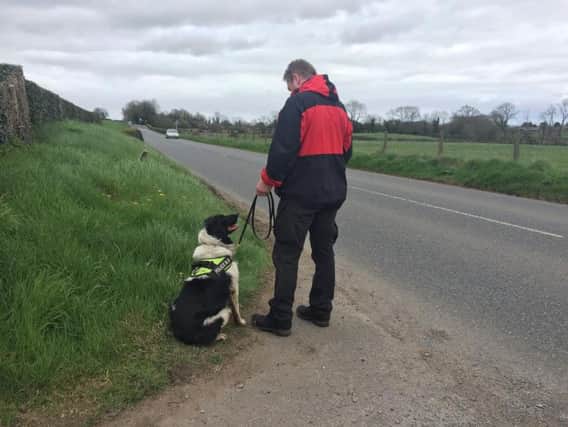 Police dog and handler involved in the search for missing Gerard Conway in Cookstown today