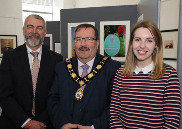 Mayor of Antrim and Newtownabbey, Councillor John Scott pictured at the launch of Recovery exhibition, with Guy McCullough photography group leader and Alexandra Baillie from Help 4 Heroes. (Contributed)