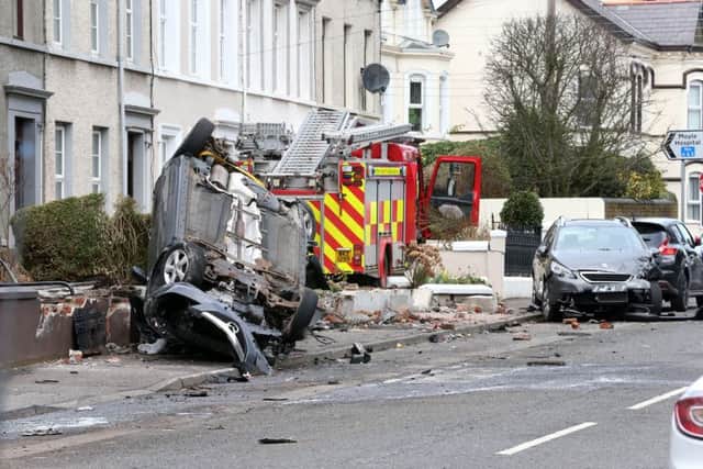 The scene on the Glenarm Road in Larne in March 2016 after a fire engine  stolen from the town's fire station crashed into a number of cars and houses.  Picture by Darren Kidd / Press Eye