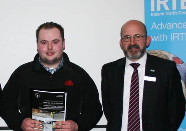Conor McDonald receives his Level 3 Apprentice of the Year Award at the annual Institute of Road Transport Engineers (IRTE) Student Awards. Conor is pictured with his tutor Basil Barnes.