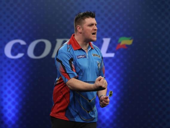 Daryl Gurney celebrates winning Saturdays Players Championship Seven in Barnsley.