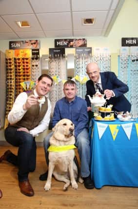 Looking forward to the Great Guide Dogs Tea Party at Specsavers in Cookstown this Friday (14 April) are from left, singer/songwriter Malachi Cush, Swatragh man Gary Loughran with his guide dog Usher and Brian OKane, store director at Specsavers, Cookstown.  The event is part of a fun-packed day for shoppers and visitors to mark both Easter and the official opening of the new Specsavers store.